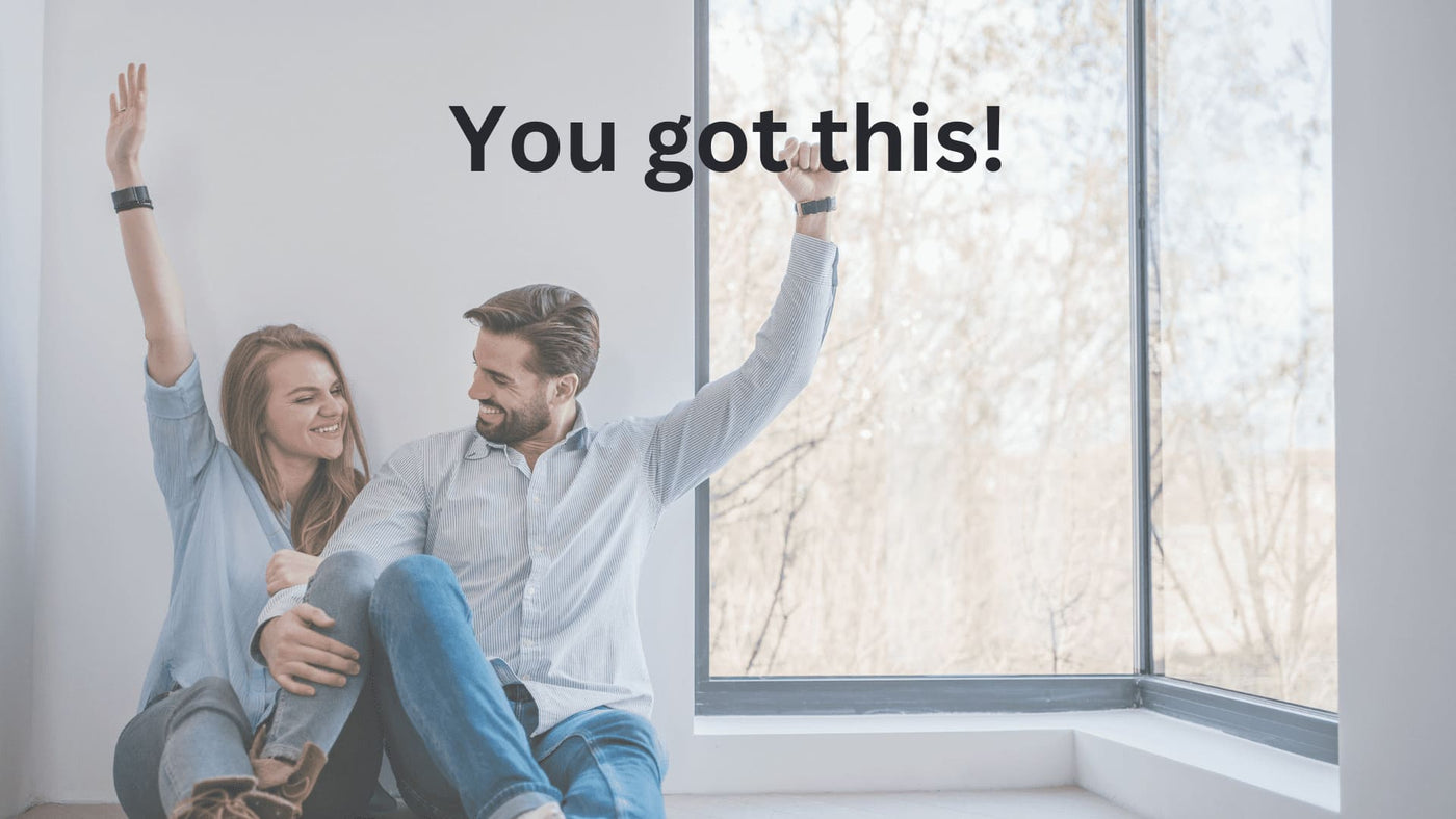 Couple happy that they just installed their mini split themselves with encouraging text that says "You got this!"